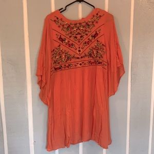 Orange stitched dress or could be worn at a top.